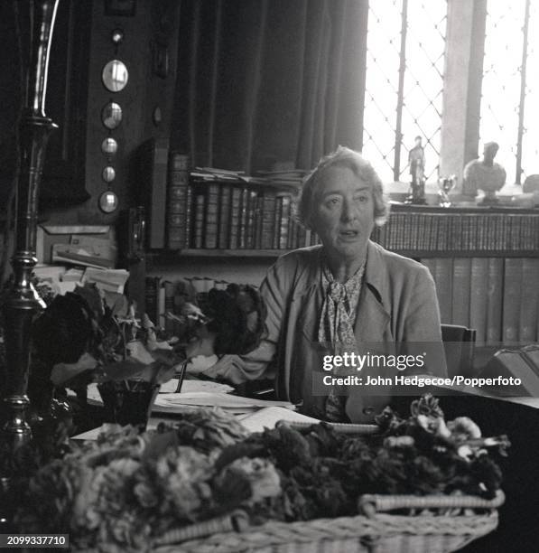 English writer and gardener Vita Sackville-West seated at a desk in her office study in the tower of Sissinghurst Castle near Staplehurst in Kent,...