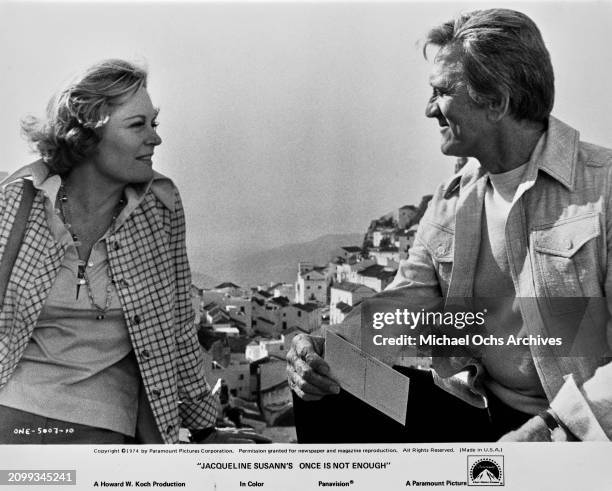 American actor and film director Kirk Douglas and Canadian-born American actress Alexis Smith in a scene from the film 'Once Is Not Enough', 1974....