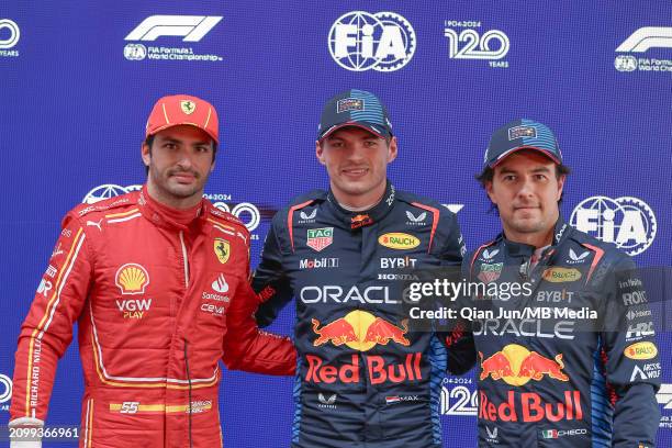 Carlos Sainz Jr of Spain and Scuderia Ferrari, Max Verstappen of the Netherlands and Oracle Red Bull Racing and Sergio Perez of Mexico and Oracle Red...