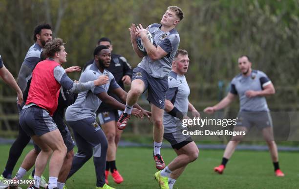 Fin Smith catches the ball during the Northampton Saints training session held at Franklin's Gardens on March 20, 2024 in Northampton, England.