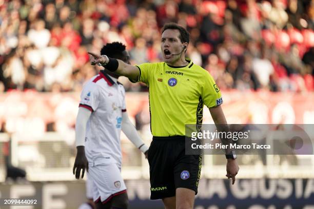 Referee Matteo Marcenaro gestures during the Serie A TIM match between AC Monza and Cagliari at U-Power Stadium on March 16, 2024 in Monza, Italy.
