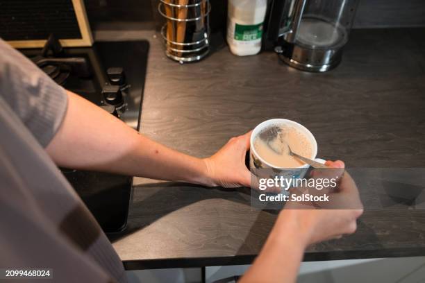 having decaf tea - stirring tea stock pictures, royalty-free photos & images