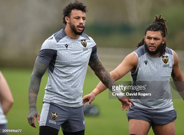 Courtney Lawes and Lewis Ludlam look on during the Northampton Saints training session held at Franklin's Gardens on March 20, 2024 in Northampton,...