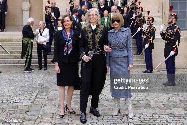 Ambassador to France Denise Bauer, Annie Leibovitz and Anna Wintour pose during the intake ceremony of Annie Leibovitz into the Académie des...