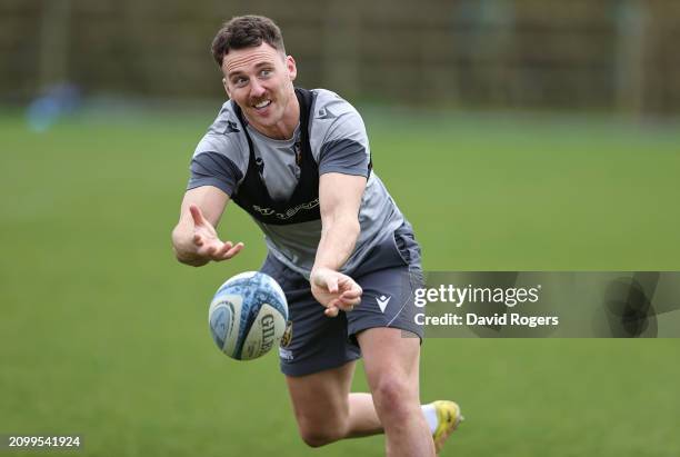 Tom James passes the ball during the Northampton Saints training session held at Franklin's Gardens on March 20, 2024 in Northampton, England.