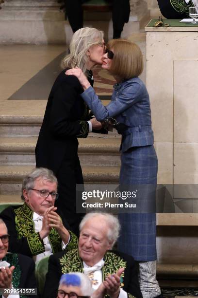 Annie Leibovitz is presented with the sword of academia by Anna Wintour during the intake ceremony of Annie Leibovitz into the Académie des...
