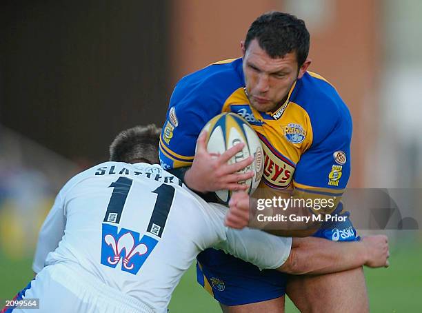 Barrie McDermott of Leeds is tackled by Troy Slattery of Wakefield during the Tetleys Bitter Super League match between Wakefield Trinity Wildcats...