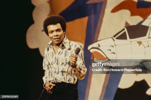 American singer Johnny Nash performs on the set of a pop music television show in London in April 1972.