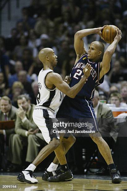Richard Jefferson of the New Jersey Nets is defended by Bruce Bowen of the San Antonio Spurs in Game six of the 2003 NBA Finals on June 15, 2003 at...