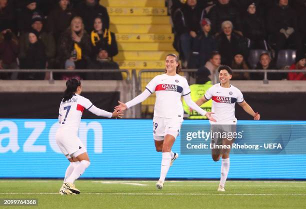 Eva Julianna Gaetino of Paris Saint-Germain celebrates scoring her team's first goal with team mate Sakina Karchaoui during the UEFA Women's...