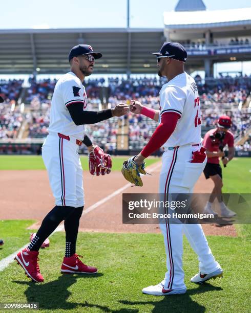 Carlos Correa and Royce Lewis of the Minnesota Twins look on during a spring training game against the Detroit Tigers on March 20, 2024 at the Lee...