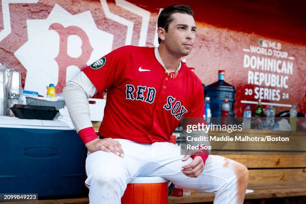 Triston Casas of the Boston Red Sox sits in the dugout during the 2024 Dominican Republic Series game against the Tampa Bay Rays as part of the MLB...