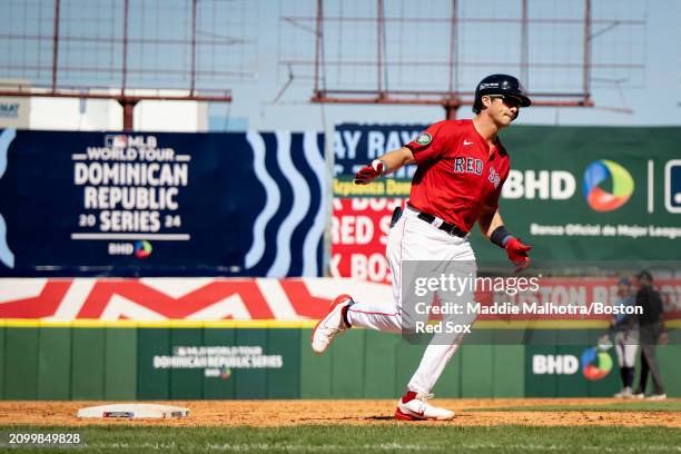 Bobby Dalbec of the Boston Red Sox reacts after hitting a grand slam during the 2024 Dominican Republic Series game against the Tampa Bay Rays as...