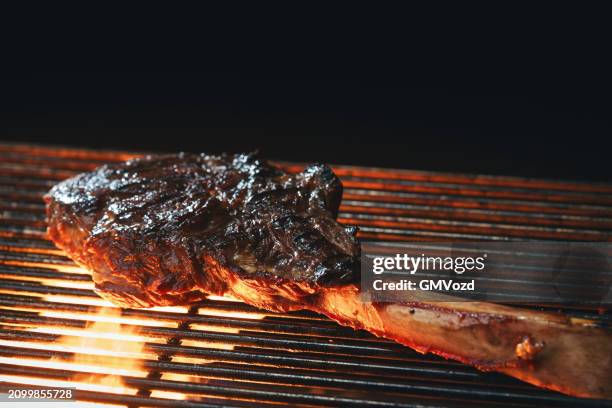 preparing tomahawk steak on bbq grill - tomahawk stock pictures, royalty-free photos & images
