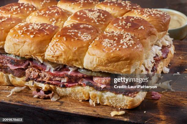 hawaiian roll reuben sliders - pastrami burger stock pictures, royalty-free photos & images