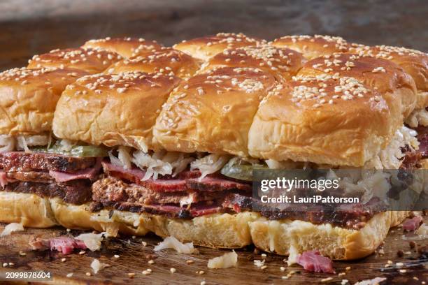 hawaiian roll reuben sliders - pastrami burger stock pictures, royalty-free photos & images