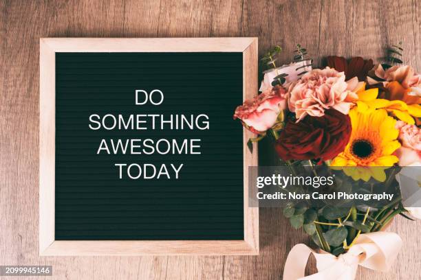 inspirational quotes on letter board - do something awesome today - words of wisdom stock pictures, royalty-free photos & images