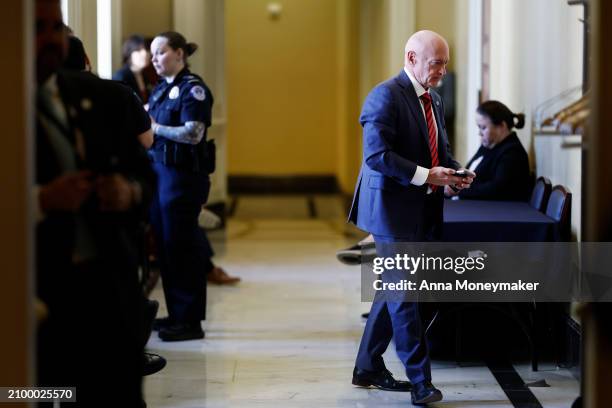 Sen. Mark Kelly returns to a Senate Democratic policy luncheon at the U.S. Capitol building on March 20, 2024 in Washington, DC. Senate Democratic...