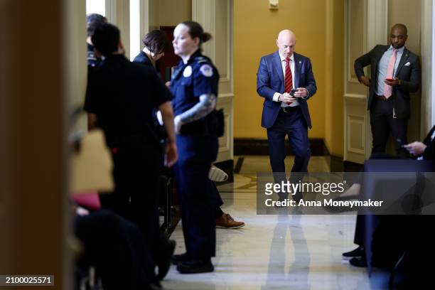Sen. Mark Kelly returns to a Senate Democratic policy luncheon at the U.S. Capitol building on March 20, 2024 in Washington, DC. Senate Democratic...