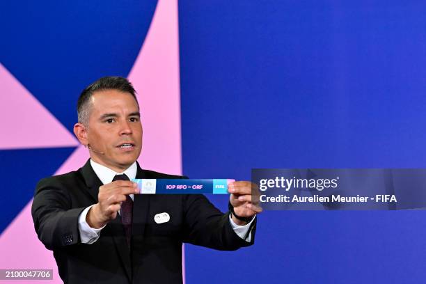 Former Footballer Javier Saviola pulls ICP AFC - CAF from the pot during the Olympic football tournament final draw at Paris 2014 HQ on March 20,...