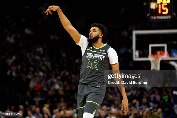 Karl-Anthony Towns of the Minnesota Timberwolves follows through on a shot against the Charlotte Hornets in the first quarter at Target Center on...
