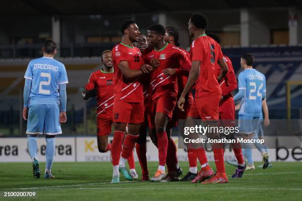 Andre Burley of St. Kitts and Nevis celebrates with team mates after scoring to give the side a 2-1 lead during the International Friendly match...