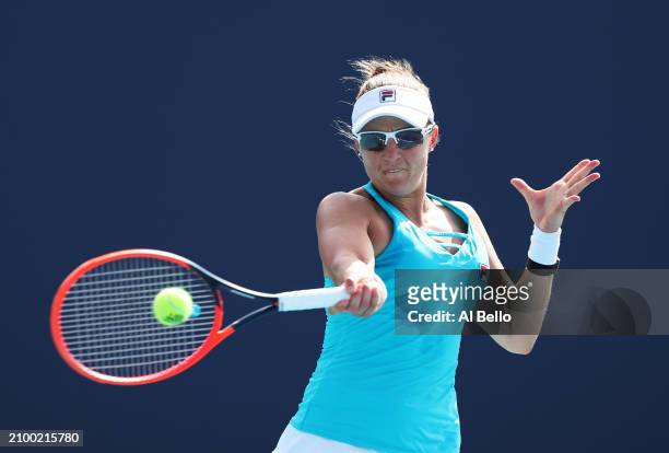 Nadia Podoroska of Argentina returns a shot against Ashlyn Krueger during their match on Day 5 of the Miami Open at Hard Rock Stadium on March 20,...