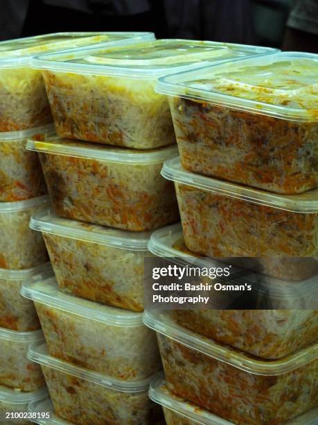 biryani being packed for customers - mithai box stock pictures, royalty-free photos & images
