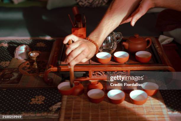 tea ceremony - adult eating no face stock pictures, royalty-free photos & images