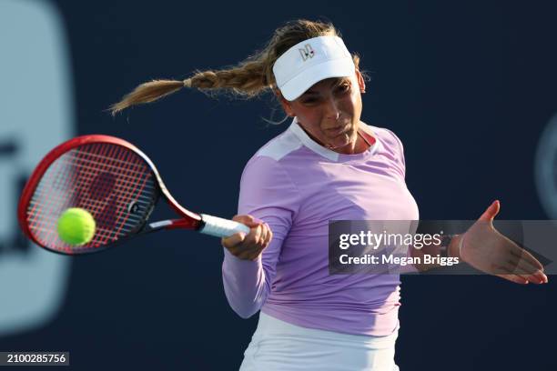 Donna Vekic of Croatia returns a shot to Karolina Pliskova of Czech Republic during her women's singles match during the Miami Open at Hard Rock...