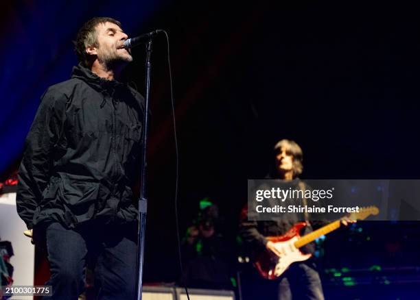 Liam Gallagher and John Squire perform at O2 Apollo Manchester on March 20, 2024 in Manchester, England.