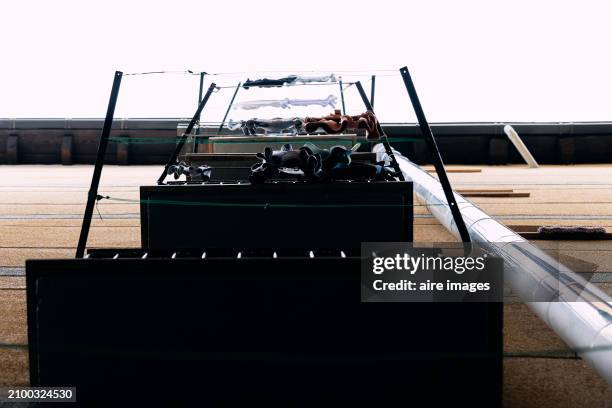 low angle view of balconies outside a residential building with clotheslines hanging, sky in the background - varal de roupa imagens e fotografias de stock