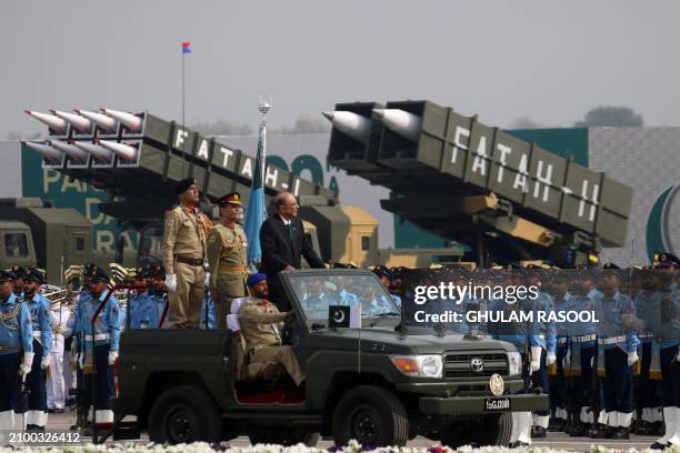 Pakistan's President Asif Ali Zardari inspects a guard of honour during Pakistan's national day parade in Islamabad on March 23, 2024.