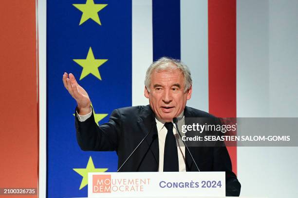 Leader of France's centrist MoDem party and High Commissioner for Planning Francois Bayrou gestures as he delivers a speech after he was reappointed...