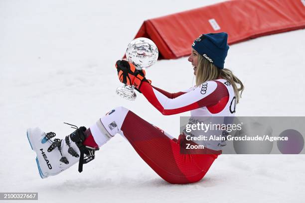 Cornelia Huetter of Team Austria wins the globe in the overall standings during the Audi FIS Alpine Ski World Cup Finals Women's Downhill on March...