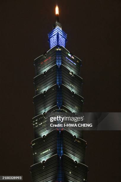 The landmark building Taipei 101 is seen with its lights switched on the Earth Hour environmental campaign in Taipei on March 23, 2024.