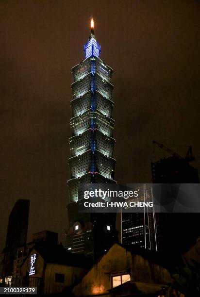 The landmark building Taipei 101 is seen with its lights switched on the Earth Hour environmental campaign in Taipei on March 23, 2024.