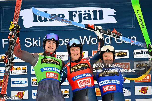 Second placed Canada's Reece Howden, Winner Sweden's David Mobaerg and third placed Sweden's Erik Mobaerg celebrate on the podium after the men's big...