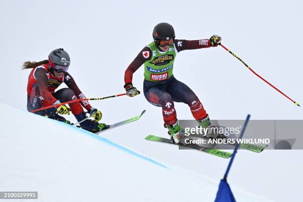 Canada's India Sherret and her compatriot Brittany Phelan compete in the women's quarter final heat 3 during the FIS Women's Ski Cross World Cup...