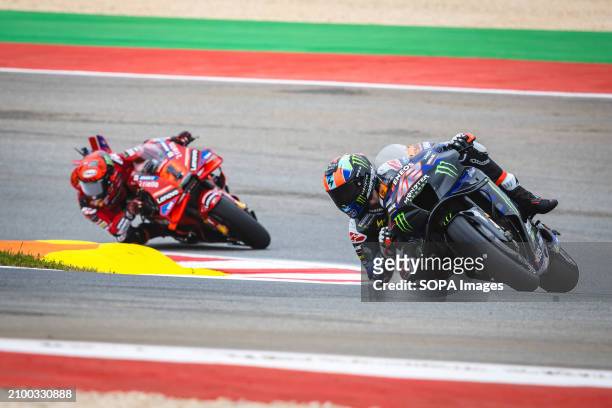 Alex Rins of Spain and Monster Energy Yamaha MotoGP and Francesco Bagnaia of Italy and Ducati Lenovo Team in action during the Free Practice Number...