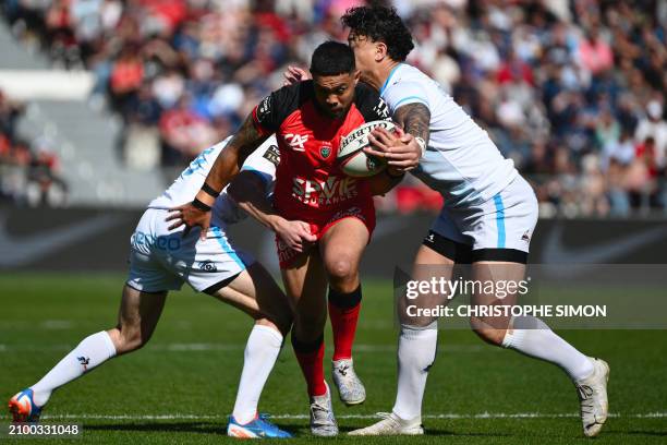 Toulon's Australian centre Duncan Paia'aua tries to escape during the French Top 14 rugby union match between Rugby Club Toulonnais and Montpellier...