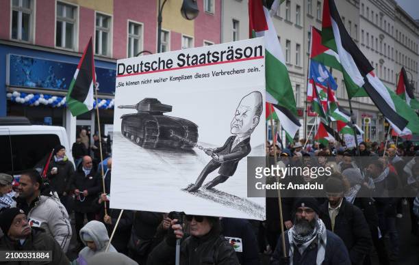 People, holding banners and Palestinian flags, gather to stage a demonstration in support of Palestinians, and to protest against Israeli attacks...