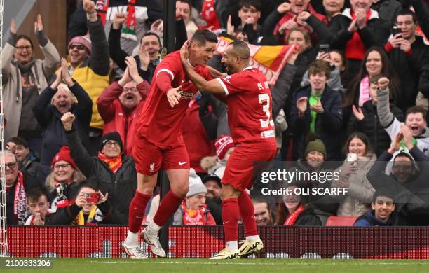 Liverpool Legends' striker Fernando Torres celebrates scoring the team's fourth goal with Liverpool Legends' striker Nabil El Zhar during the Legends...