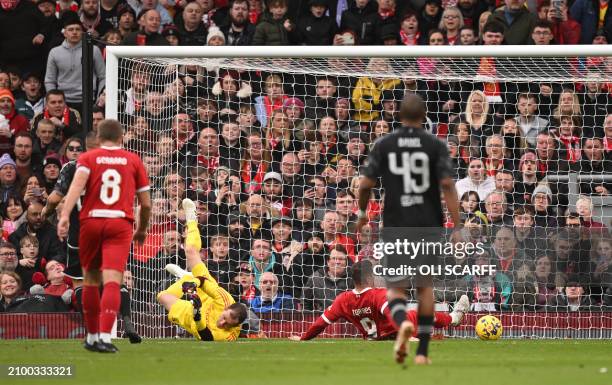 Liverpool Legends' striker Fernando Torres scores the team's fourth goal during the Legends football match between Liverpool Legends and Ajax Legends...