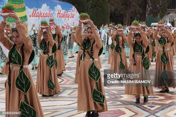 Tajiks celebrate Navruz , an ancient festival marking the first day of spring in Central Asia, in Dushanbe on March 23, 2024.