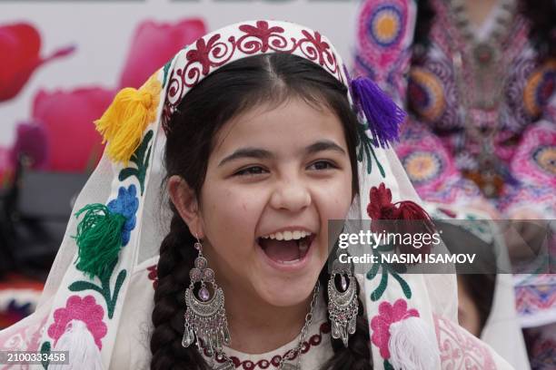 Tajik girl celebrates Navruz , an ancient festival marking the first day of spring in Central Asia, in Dushanbe on March 23, 2024.