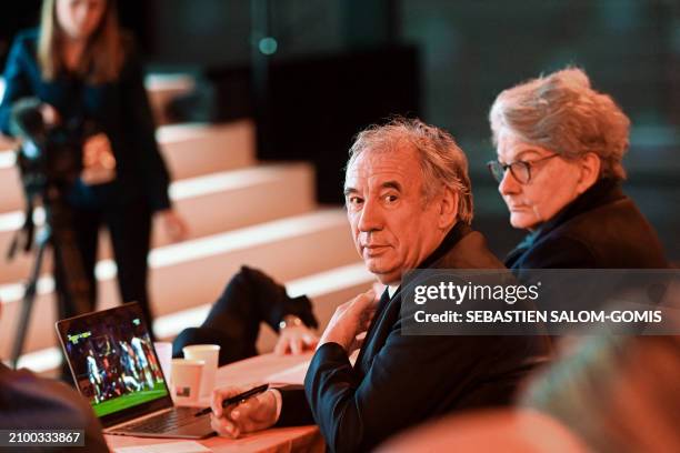 Leader of France's centrist MoDem party Francois Bayrou and European Commissioner for the Internal Market Thierry Breton watch a rugby match on...