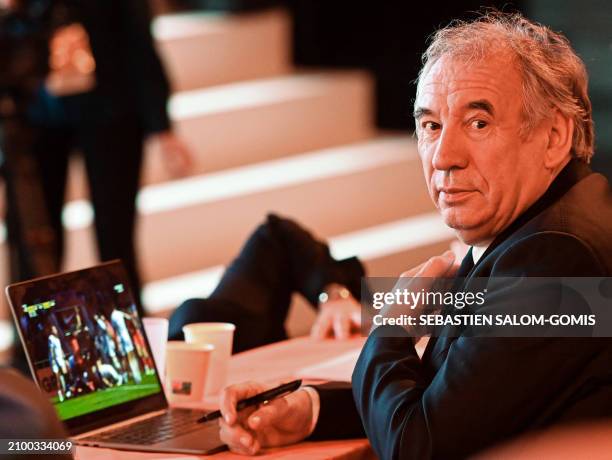 Leader of France's centrist MoDem party Francois Bayrou watches a rugby match on his laptop during the party's Congress in Blois, center France, on...