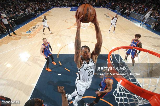 Nicolas Claxton of the Brooklyn Nets dunks the ball during the game against the New York Knicks on March 23, 2024 at Madison Square Garden in New...