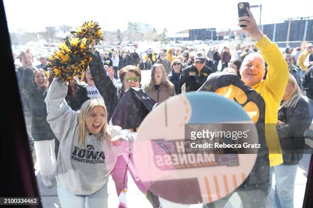 Fans line up at the south entrance to Carver-Hawkeye Arena prior to tipoff between the Iowa Hawkeyes and Holy Cross Crusaders during the first round...